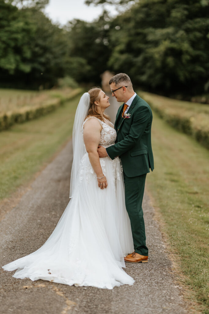 Couple Photos in the gardens at Crowcombe Court during a summer wedding in Somerset, captured by a Crowcombe Court wedding photographer.