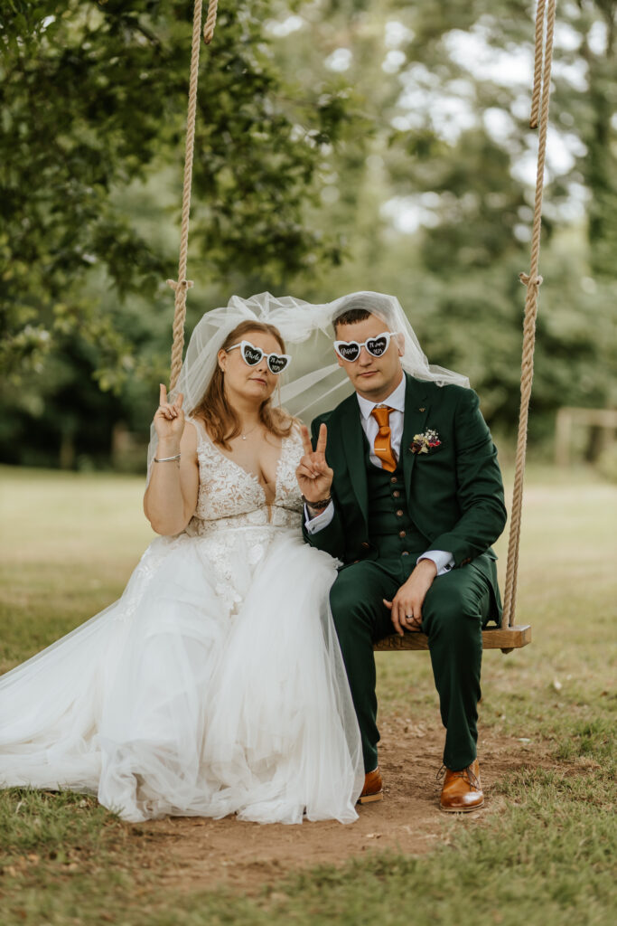 Couple Photos in the gardens at Crowcombe Court during a summer wedding in Somerset, captured by a Crowcombe Court wedding photographer.