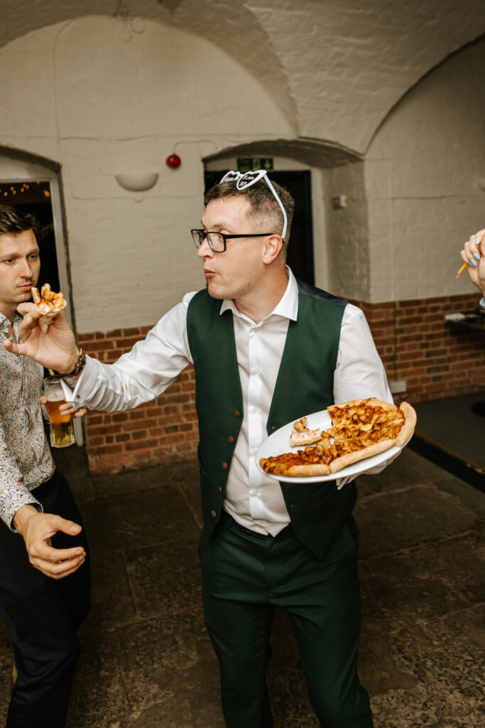 Dancing in the Undercroft at Crowcombe Court during a summer wedding in Somerset, captured by a Crowcombe Court wedding photographer.