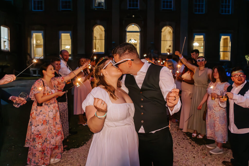 Sparklers at Crowcombe Court during a summer wedding in Somerset, captured by a Crowcombe Court wedding photographer.