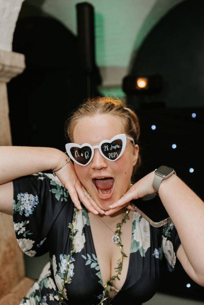Dancing in the Undercroft at Crowcombe Court during a summer wedding in Somerset, captured by a Crowcombe Court wedding photographer.