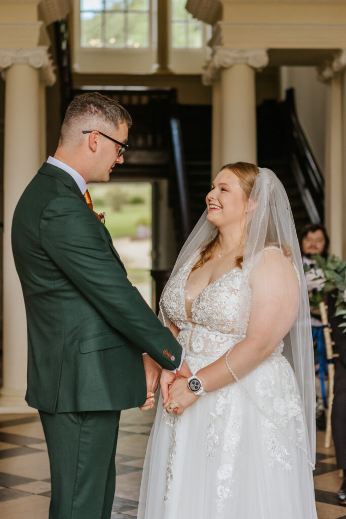 Bride and groom in the great hall at Crowcombe Court during a summer wedding in Somerset, captured by a Crowcombe Court wedding photographer.