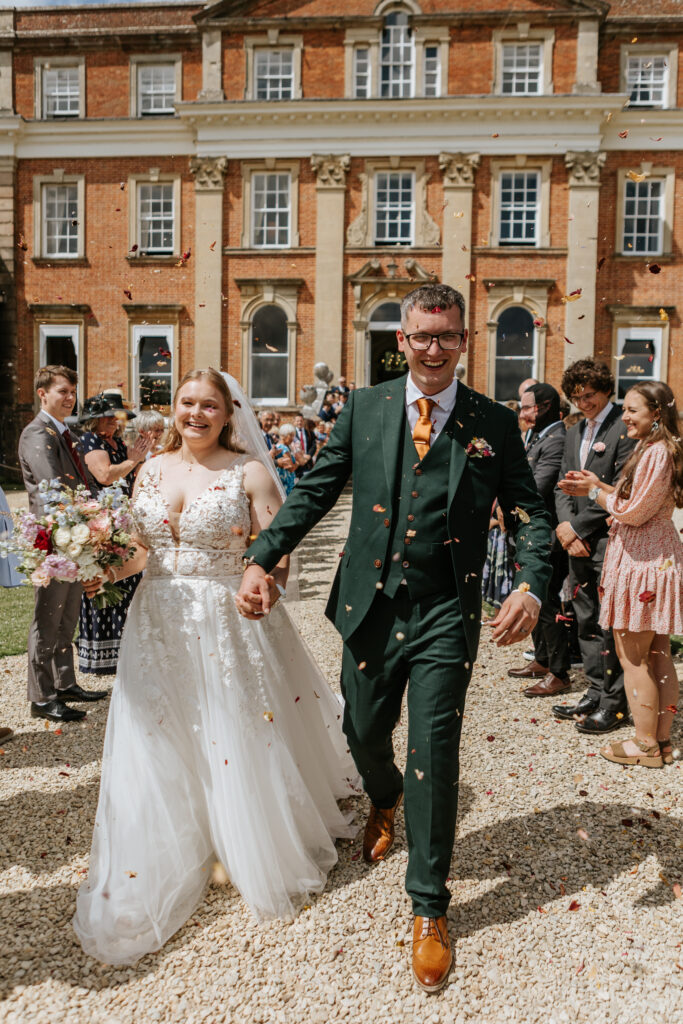 Confetti in the gardens at Crowcombe Court during a summer wedding in Somerset, captured by a Crowcombe Court wedding photographer.