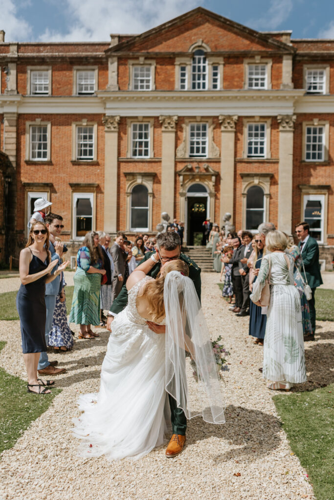 Confetti in the gardens at Crowcombe Court during a summer wedding in Somerset, captured by a Crowcombe Court wedding photographer.