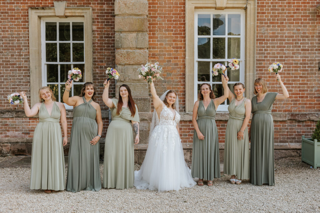 Bridesmaid Photos in the gardens at Crowcombe Court during a summer wedding in Somerset, captured by a Crowcombe Court wedding photographer.