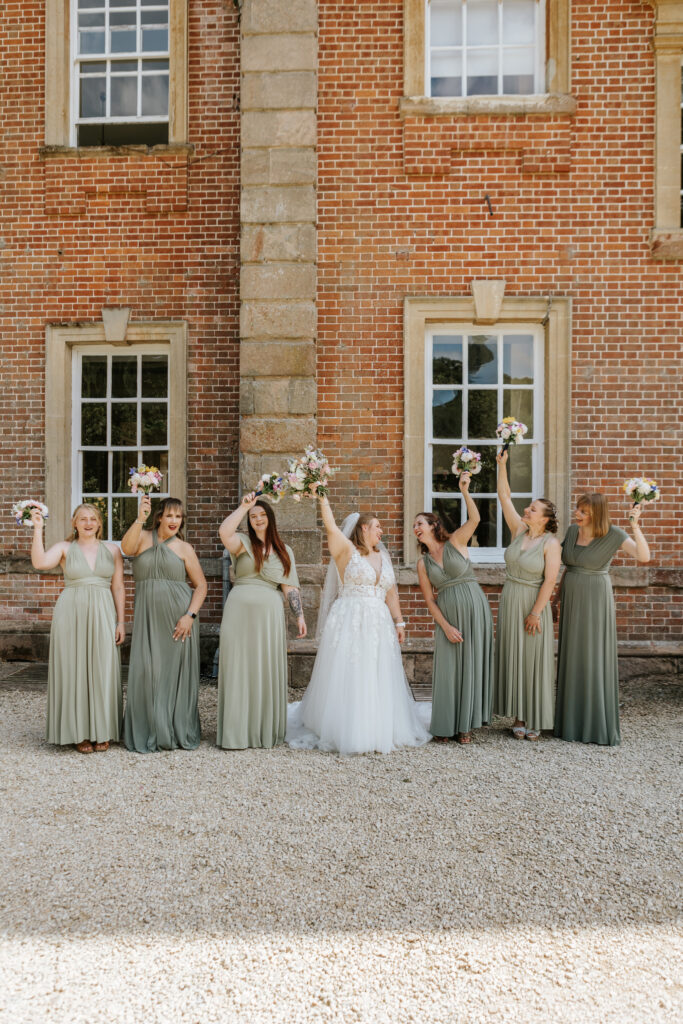 Bridesmaid Photos in the gardens at Crowcombe Court during a summer wedding in Somerset, captured by a Crowcombe Court wedding photographer.