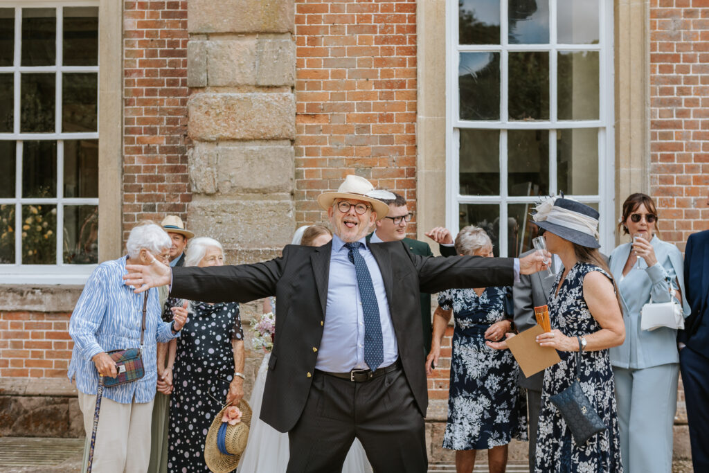 Group Photos in the gardens at Crowcombe Court during a summer wedding in Somerset, captured by a Crowcombe Court wedding photographer.