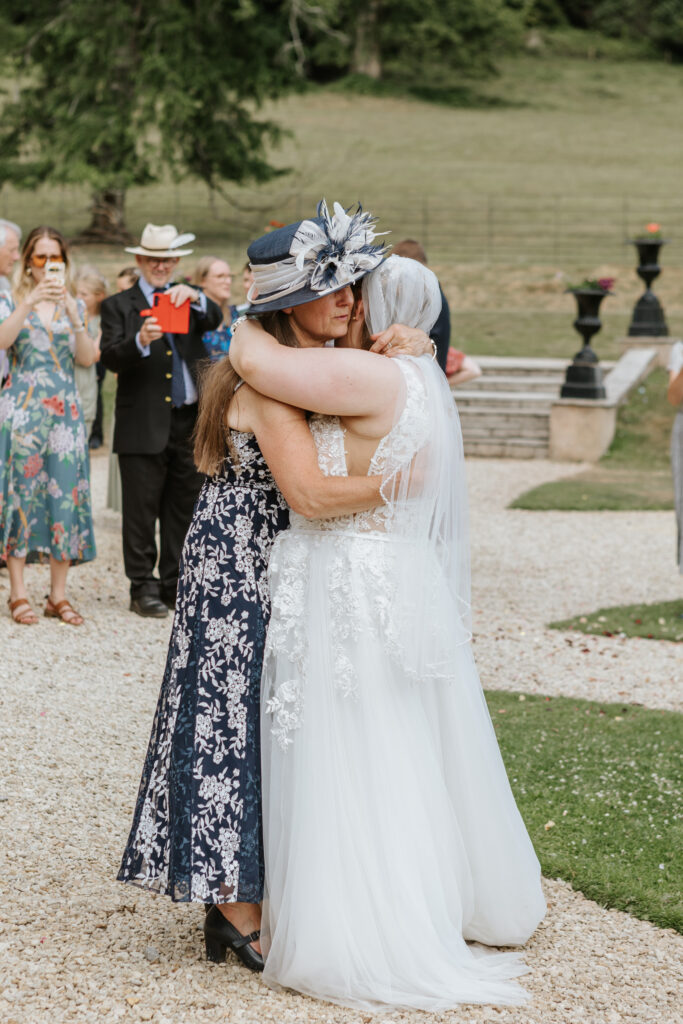 Mother daughter dance in the gardens at Crowcombe Court during a summer wedding in Somerset, captured by a Crowcombe Court wedding photographer.