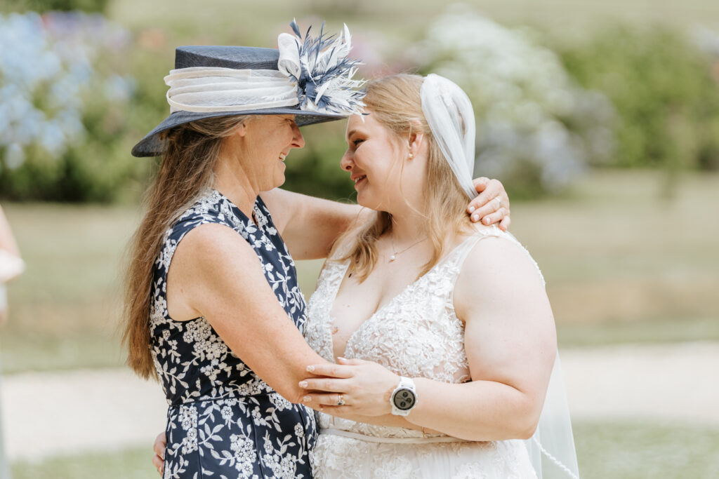 Mother daughter dance in the gardens at Crowcombe Court during a summer wedding in Somerset, captured by a Crowcombe Court wedding photographer.
