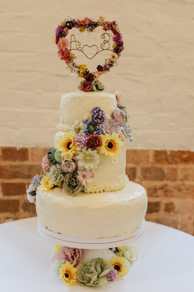 Wedding Cake at Crowcombe Court during a summer wedding in Somerset, captured by a Crowcombe Court wedding photographer.
