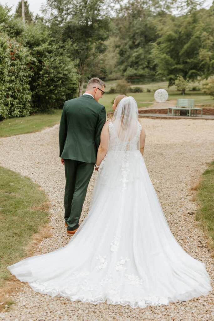 Couple Photos in the gardens at Crowcombe Court during a summer wedding in Somerset, captured by a Crowcombe Court wedding photographer.