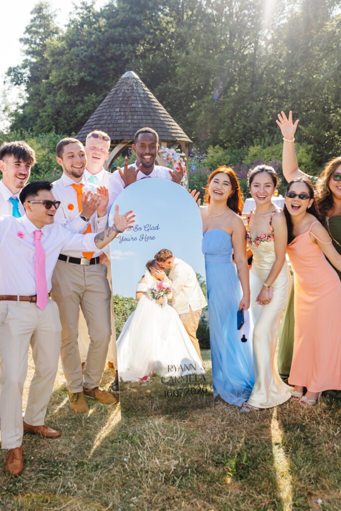 Bridal party in mirror at Priston Mill near Bath