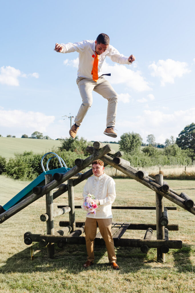 Fun groom bouquet toss at Priston Mill near Bath