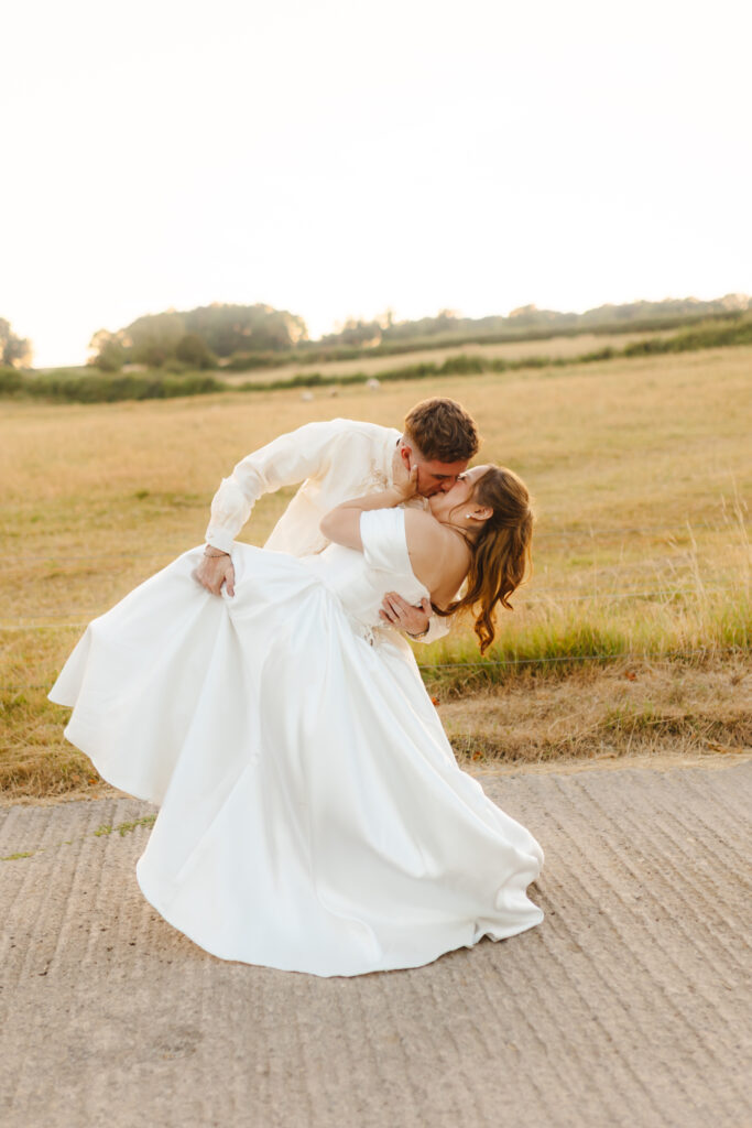 Golden hour sunset dip kiss couple portraits at Priston Mill near Bath