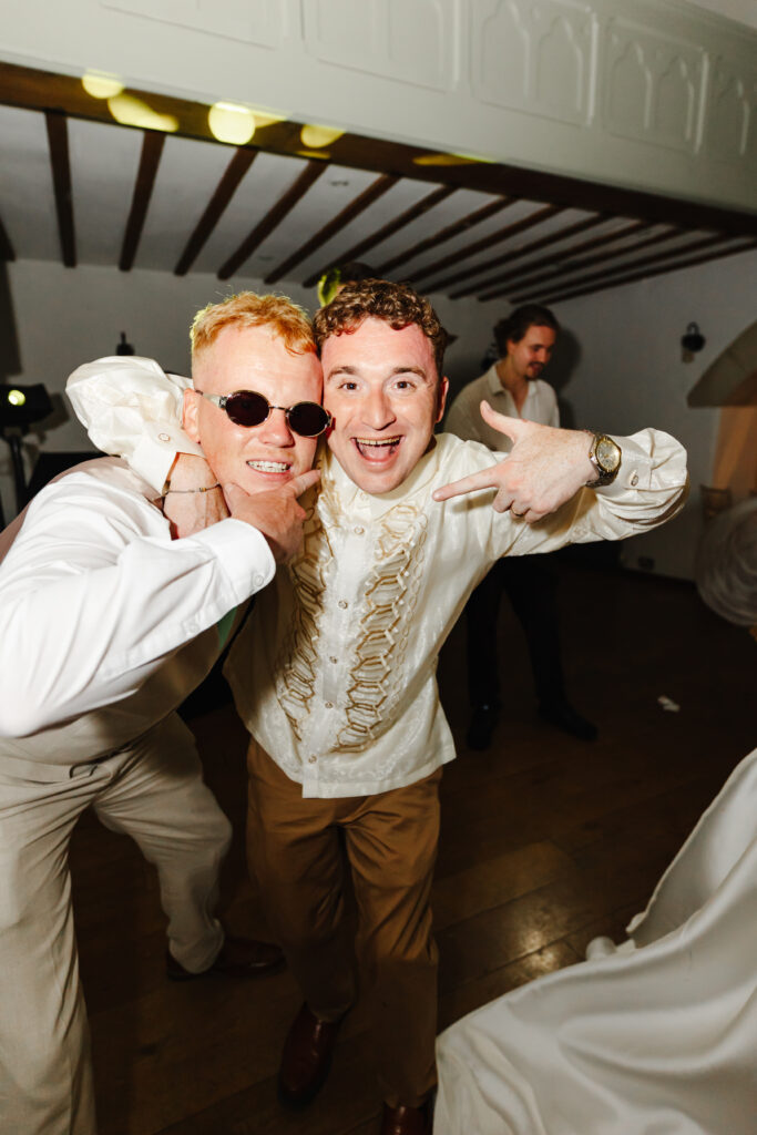 Groom and groomsmen fun dance photo in The Watermill at Priston Mill near Bath